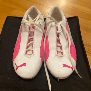 Pink and white puma athletic sneakers